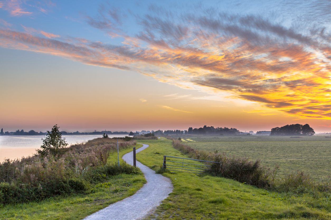 Holland landscape with winding cycling track Dutch Weather